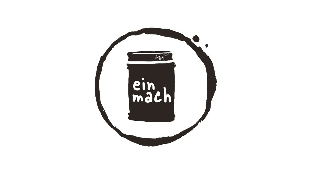 Logo der Einmachbibliothek. Weisse Schrift auf schwarzem Grund in Form eines Einmachglases. Darum ein Kreis